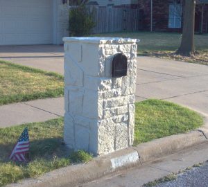 Stone mailbox painted